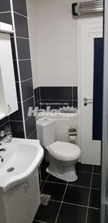 Garsonjera Krnjača 27m2 + parking mesto u dvorištu — 11